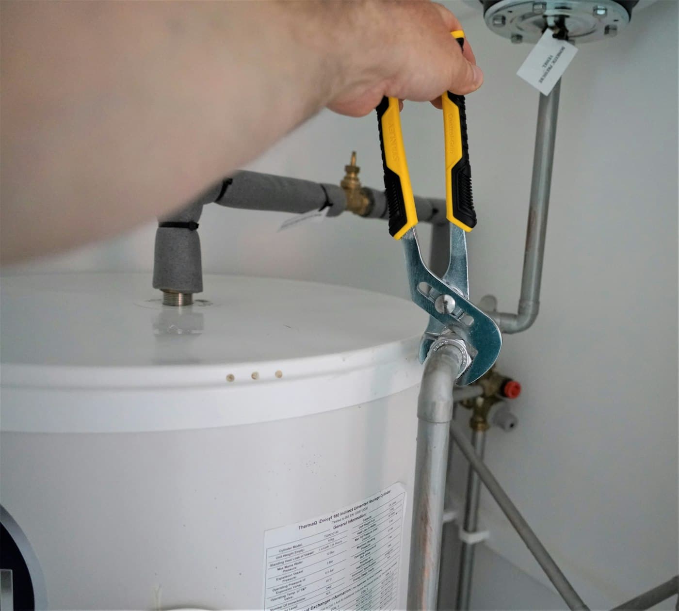 Wrench on the fittings of a water heater